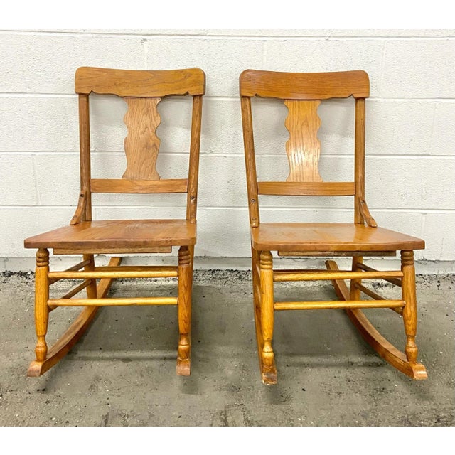 This is a gorgeous pair of vintage oak child rocking chairs. Solid, sturdy, and rock well! Minor cosmetic imperfections...