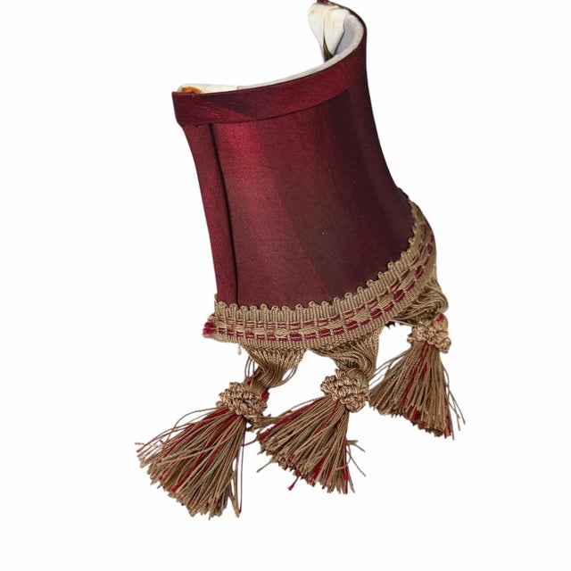 Vintage burgundy silk nightlight or wall sconce half lamp shade with tassel trim. Measures 4.5” w at bottom, 3” w at top x...