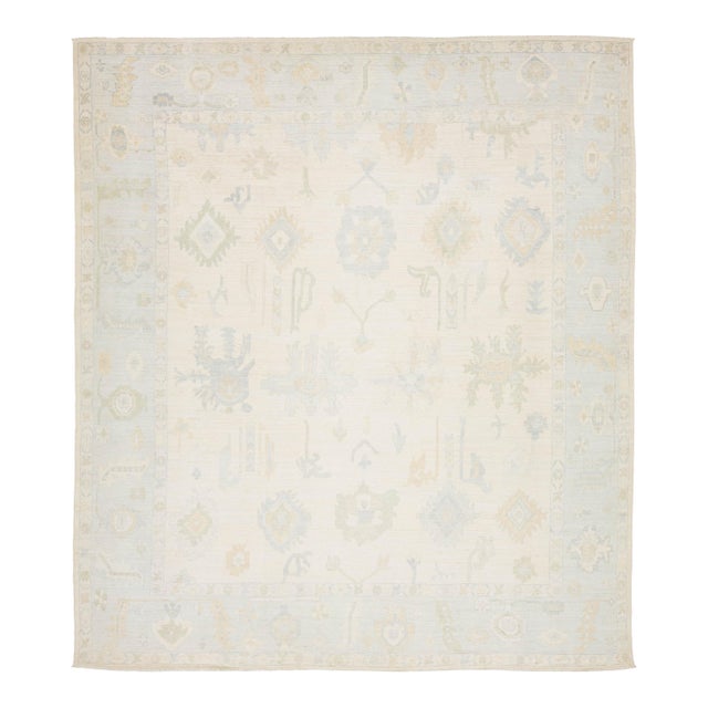 Artisanal Oushak Style Wool Area Rug: Neutral Ivory With Muted Floral Motifs For Sale