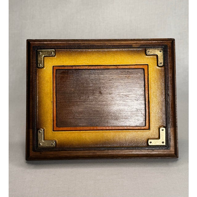 The wood of this vintage tabletop picture frame has been stained a dark coffee stained colored stained wood which...