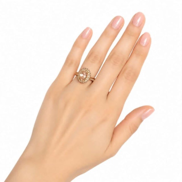 Elegant 14K rose pink gold cocktail engagement ring featuring a 1.7 carats natural oval morganite center, accented with...