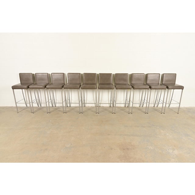 A gorgeous set of ten contemporary or Modern "Switch" bar stools By Coalesse for Steelcase USA, 2010 Leather upholstered...