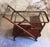 Mid Century Serving Bar cart by Cesare Lacca for Cassina. Wooden structure with glass top. It has a removable tray. Good...