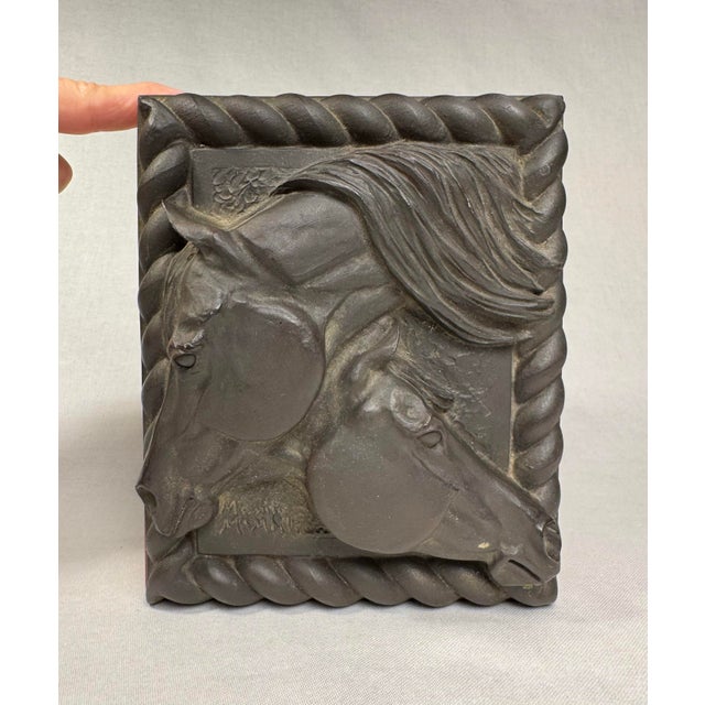Highly detailed and two dimensional is this two bas-relief, (or low-relief) horse heads which are framed by a rope-like...
