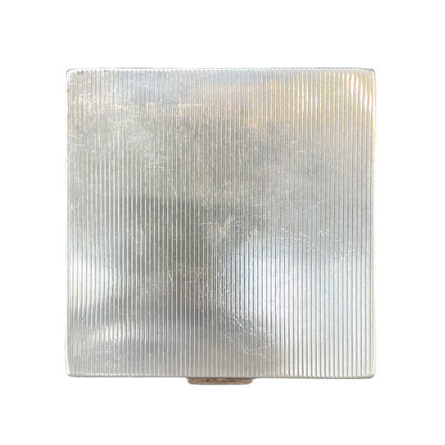 Authentic vintage Tiffany & Co. compact. Total Weight: 126.34gm. Crafted in sterling silver with 14k gold details and...