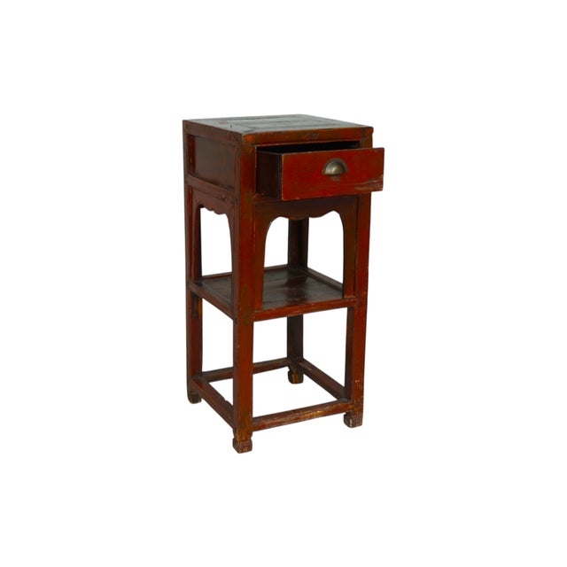 An antique Ming style “tea table”. Square with a single drawer that opens with a halfmoon shaped cup drawer pull. A...