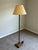 Elegant twisted bronze-tone floor lamp Baker Furniture, featuring a sculptural spiral column raised on a stepped square...