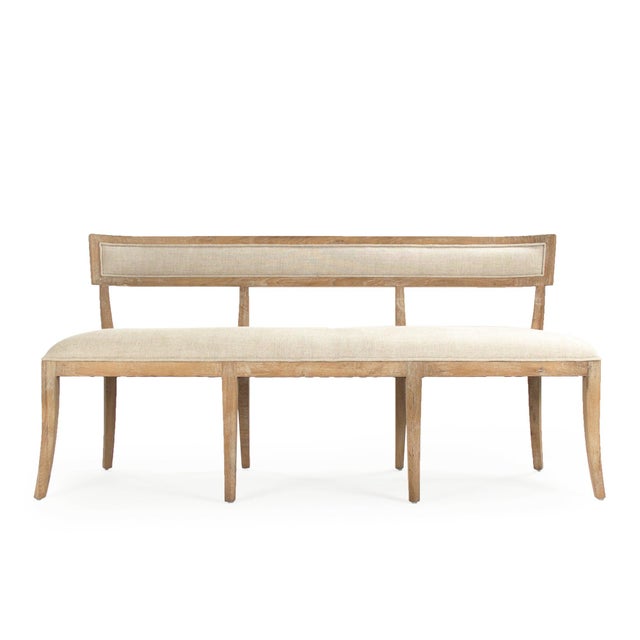 The Carvell Bench from Zentique extends the klismos-inspired silhouette to a graceful dining bench that seats three. The...