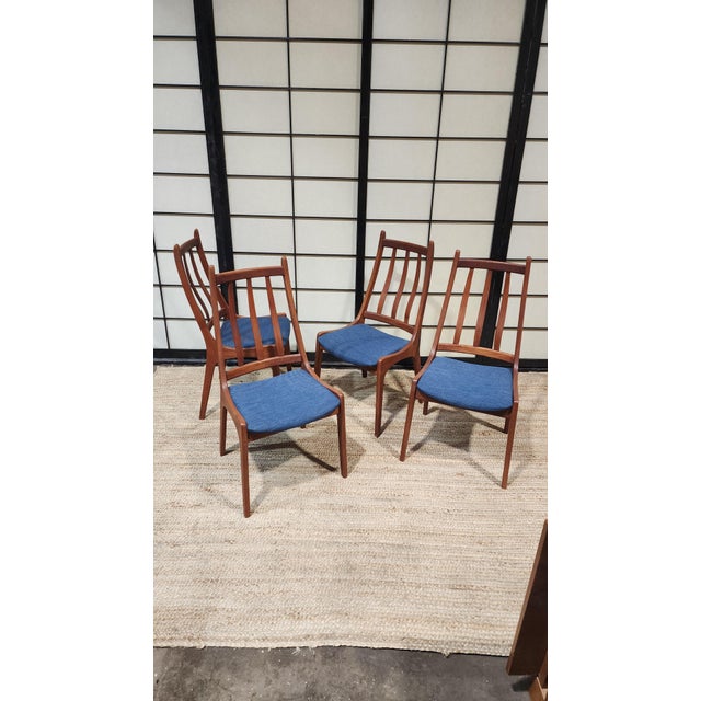 Vintage set of 4 teak dining chairs with new blue seats. made by Nordic, a Canadian mid century furniture company