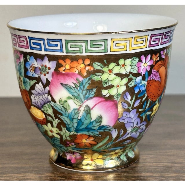 This is a Vintage 1970’s Chinese Zhongguo Chao Cai Gilded Mille Fleur Porcelain Teacup. It measures 2 3/4” tall and 3 1/4”...