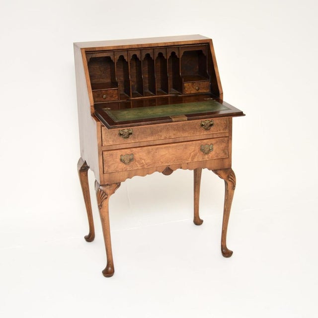 A superb antique burr walnut writing bureau, made in England and dating from the 1920-30’s. It is of outstanding quality,...