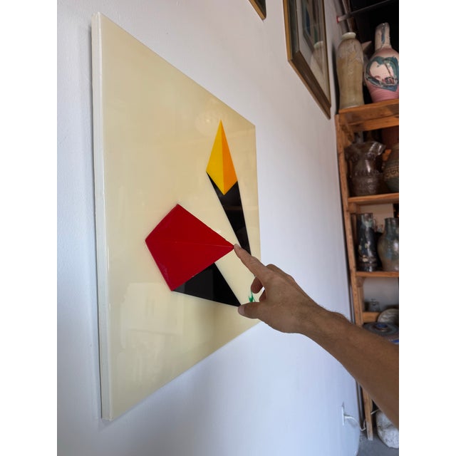 This striking contemporary mixed media wall artwork titled "Two Pyramids" features a bold geometric composition with...