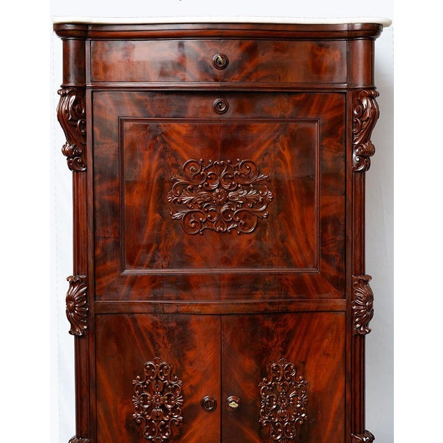 Antique Neapolitan Louis Philippe-style secretaire in mahogany veneer with a white statuary marble top. The piece is...
