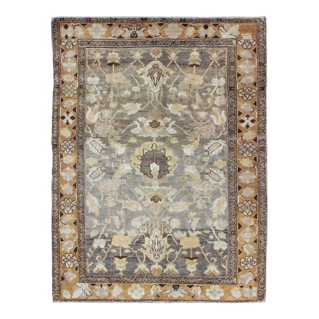 Antique Persian Bakhtiari Rug With Soft Earth-Toned Floral and Botanical Motifs For Sale