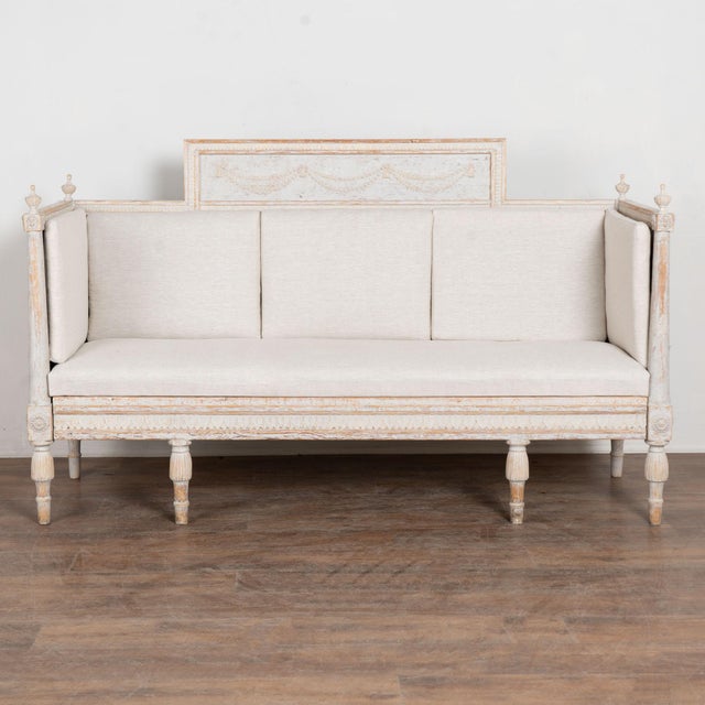 Early 19th century Swedish Gustavian bench crafted in pine. Detailed egg and dart carving embellishes both the upper rail...