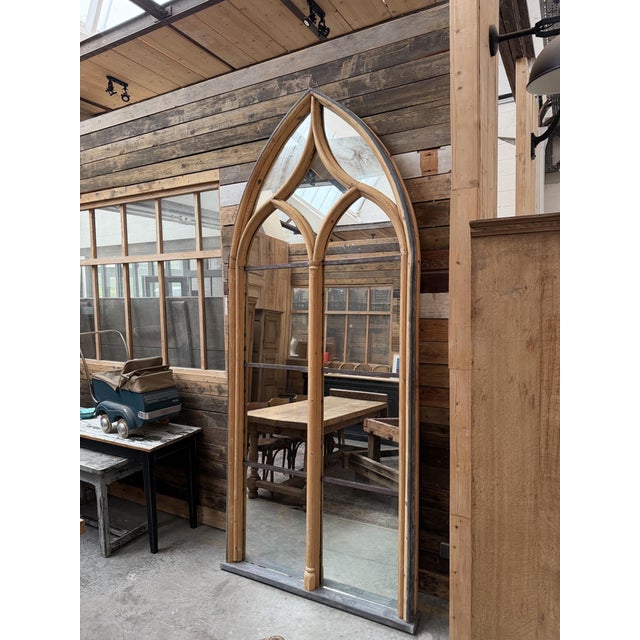 This immense mirror made of wood and metal was created from a former chapel stained-glass window. Antique mirrors have...