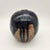 Spherical stoneware weed pot with deep cobalt-blue speckled glaze over exposed sandy clay body, small pinched opening, and...