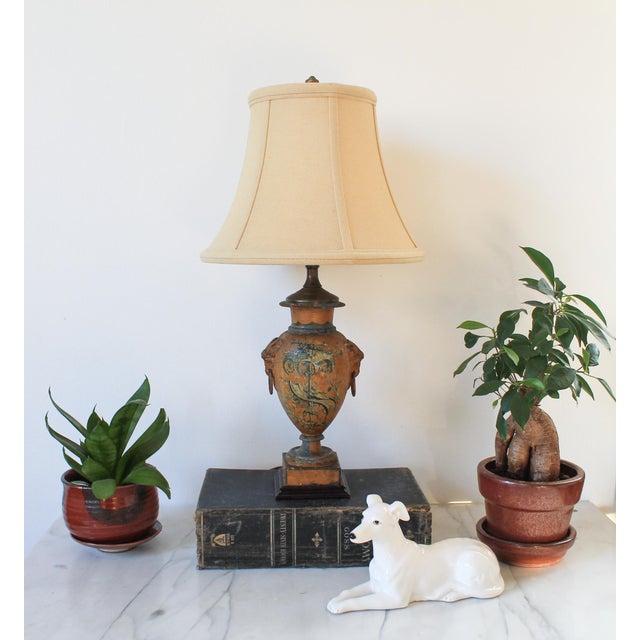 Vintage Asian style hand painted urn shape lamp with goat head motif. No makers mark. Wired and in working condition. Can...