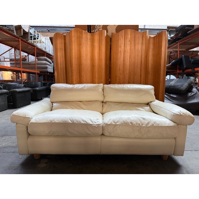 Cream colored luxury sofa made by Italian brand Poltrona Frau. Designed by Tito Agnoli in the 70s. Sumptious plume filled...