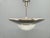 Elegant Bauhaus pendant light from the 1930s, crafted in Czechoslovakia. This refined fixture combines a wide nickel-...