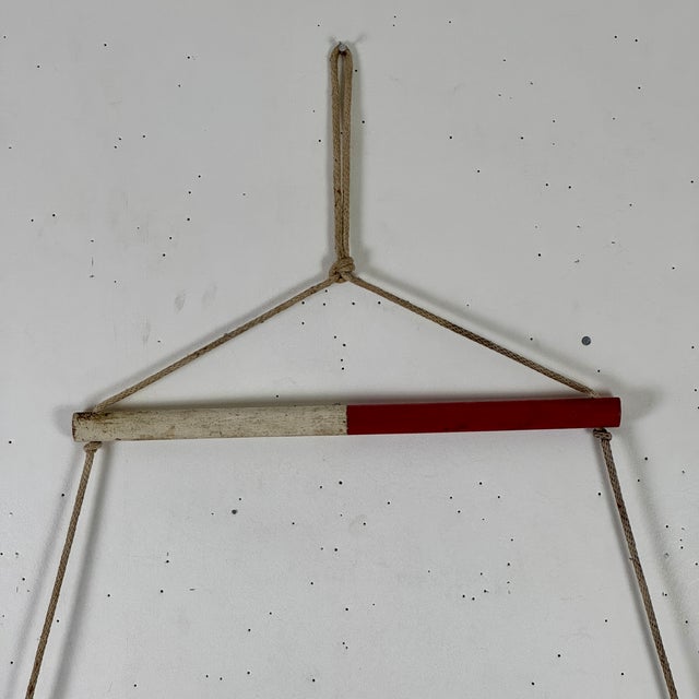 A hand constructed primitive Folk Art wall decoration in a form of a 3 steps nautical ladder. The three graduated rods are...