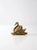 This is a vintage brass swan figure or paper weight. The brass plaque pictures a swan serenely floating on water. A red...