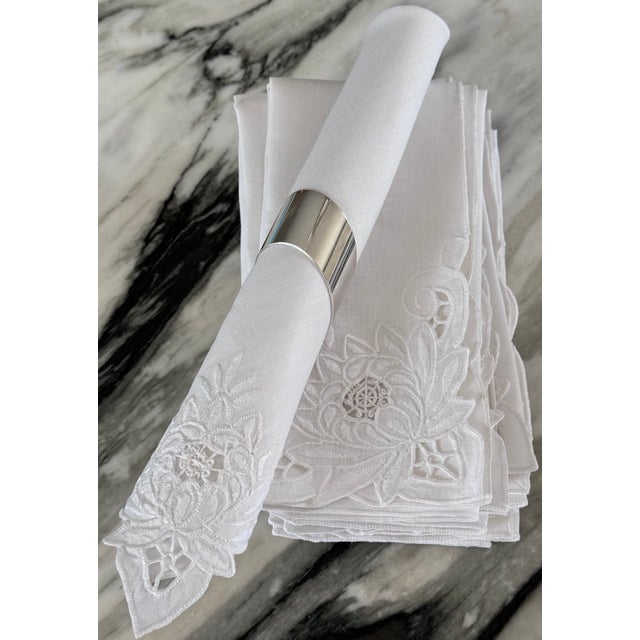 Here is a set of 8 bright white napkins in a lotus flower motif. Excellent condition, scalloped finished edge and lotus...