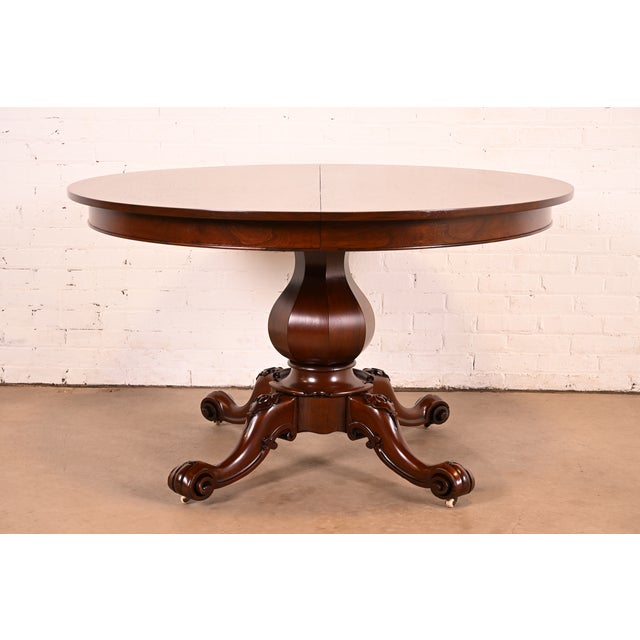 An outstanding antique Victorian, American Empire, or Renaissance Revival extension dining table In the manner of R.J....