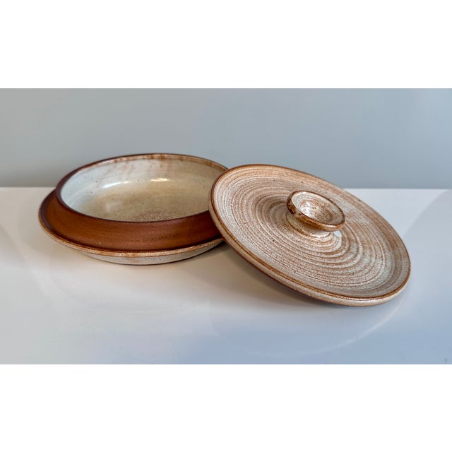 A high-quality studio ceramic art pot with lid, created by the renown German ceramic artist Helma Klett (1908-1996) around...