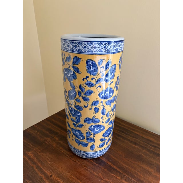 A gorgeous Chinoiserie yellow, blue and white porcelain umbrella or cane stand with Asian floral designs China, Late 20th...