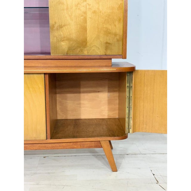 For sale is a beautiful vintage highboard, perfect for use as a bar cabinet. This piece of furniture impresses with its...