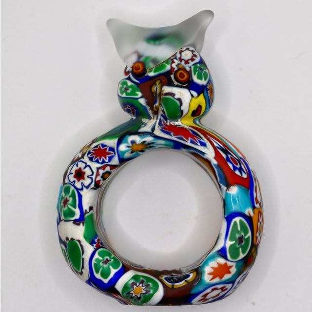 Bring vibrant Venetian charm to your tablescape with this exceptional pair of vintage Murano art glass napkin rings....
