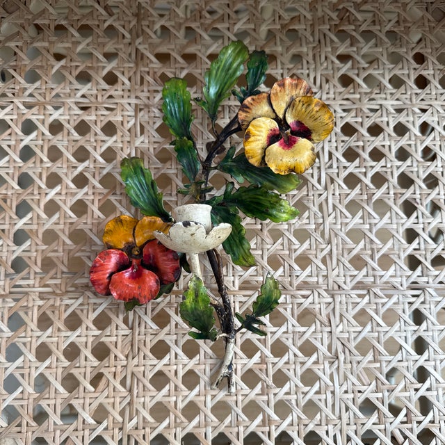 Midcentury chippy Italian tole candle sconce featuring colorful orange and yellow hand painted pansies with green leaves....