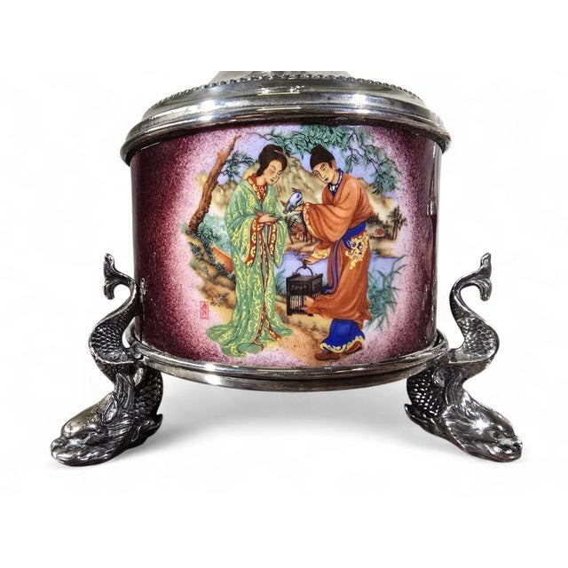 Elegant pair of Asian-style table lamps crafted in solid silver and richly decorated with colorful enamel work in...