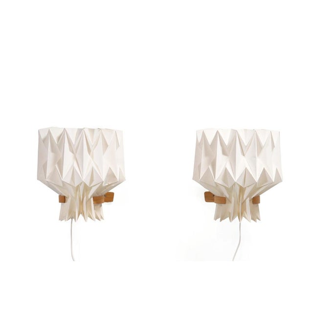 A unique set of two rare wall lamps designed by Peter Hvidt & Orla Mølgaard-Nielsen and produced by Le Klint. The lamp...