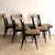 This refined set of six mid-20th-century dining chairs embodies the sculptural elegance of 1950s Italian design, in the...