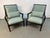 This pair of Hollywood Regency Style accent armchairs features an ebonized bamboo frame with distinctive fretwork lattice...