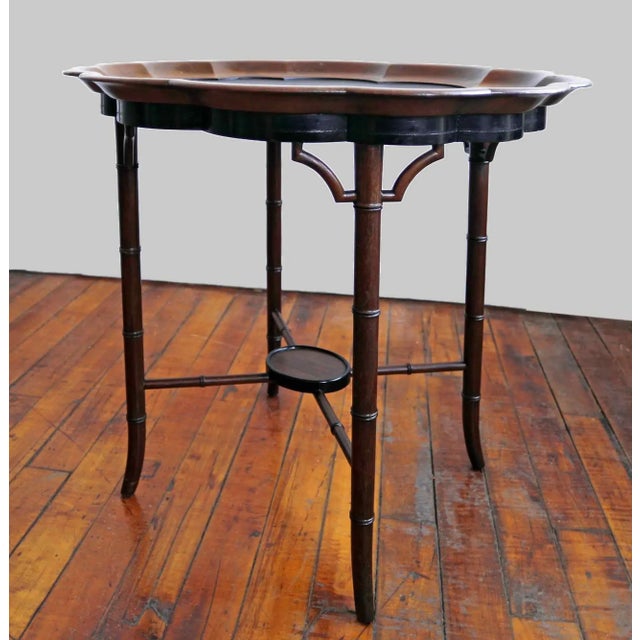 Antique English Regency style tray table, featuring a scalloped papier-mache or tole tray top set upon a faux bamboo base...