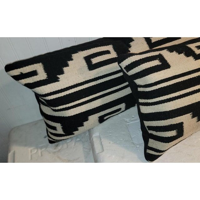 Pair of Early Mexican Indian weaving pillows in fine condition. The condition are very good. The backings are black suede.