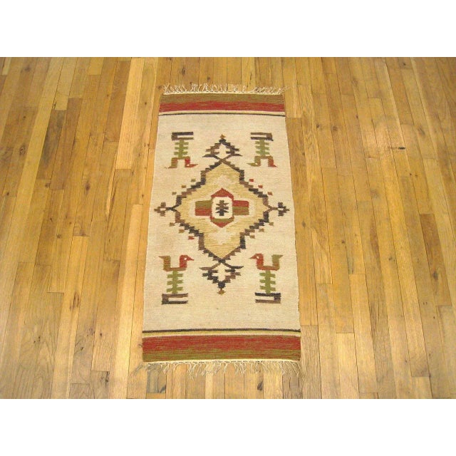 A vintage decorative rug from the Zapotec Indian tribe in Oaxaca, Mexico, size 3'3 x 1'8, featuring a central medallion on...