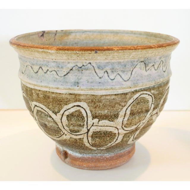 A mid-century one of a kind artisan made art pottery. Rich color hues of hand thrown earthy tones, reflecting old-world...