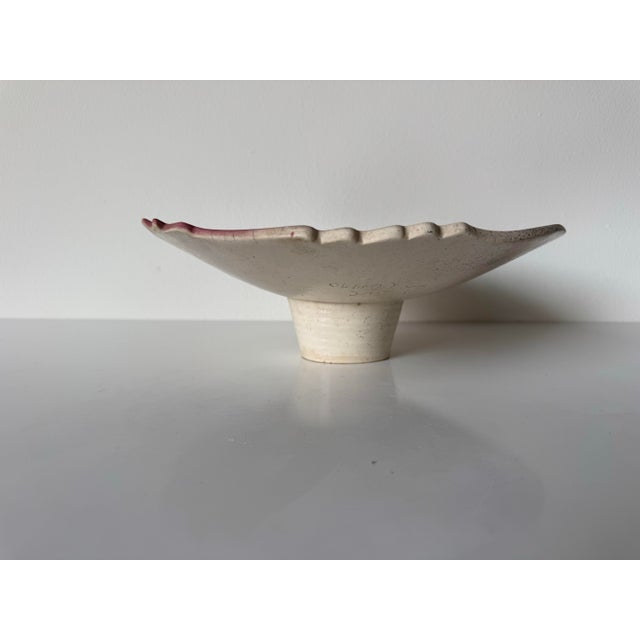 Striking vintage art ceramic pedestal bowl created in the 1990s and signed J. Koons, featuring a highly graphic,...