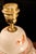This hand-painted Spanish porcelain lamp is adorned with delicate floral motifs in warm tones, reflecting Spanish...