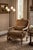 MOBILE-READY DESCRIPTION A refined Thomasville French Provincial style armchair featuring a carved, antiqued wood frame...