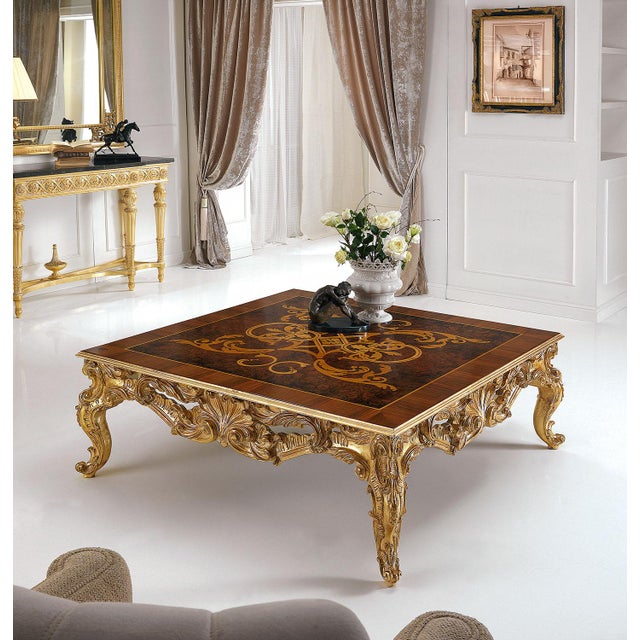 Handcrafted in Italy from solid wood. The table features intricate hand-carvings covered in a refined white patina,...