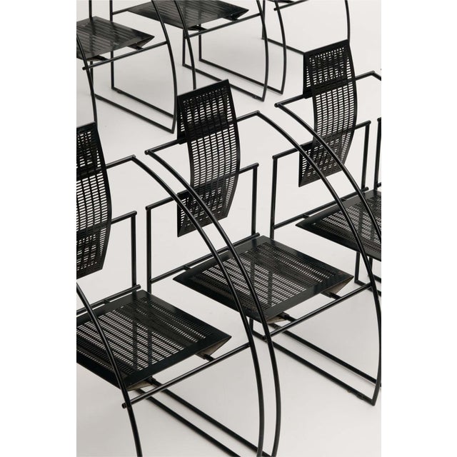 Set of eight Quinta chairs, designed by Swiss architect and designer Mario Botta and produced by Alias. Created in the...