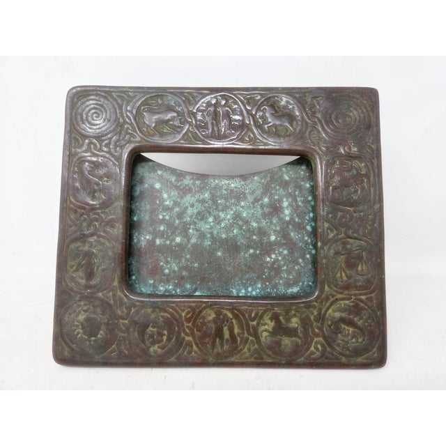 Here is an antique Tiffany Studios New York bronze picture frame made in the early 1900s. The art deco style features the...