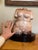 Hand carved from pink marble, large, curvy female form torso on a black Formica base. Skillfully carved, smooth to the...