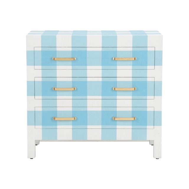 A playful raffia chest in a charming blue and white plaid that makes us smile. Three drawers with gold leaf handles....