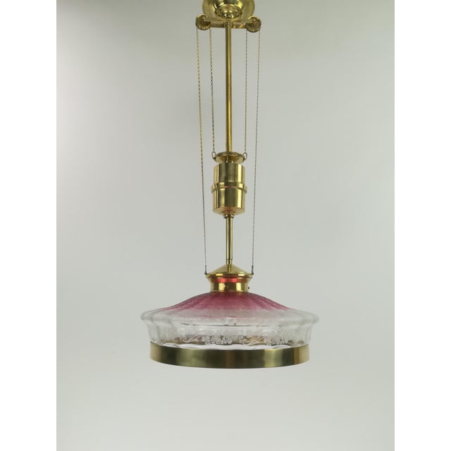 Solid brass chandelier with a pull system, adjustable as desired, total length 95cm-120cm The lamp has a beautiful old...